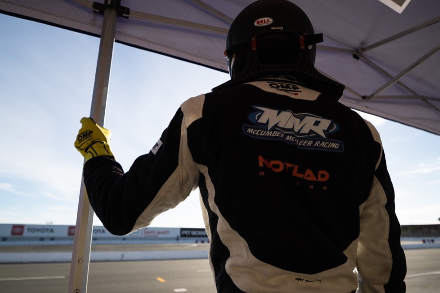 Ren on the pit wall in his MMR suit